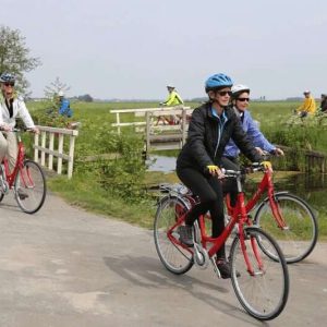 Cyclists in the nature with a small bridge