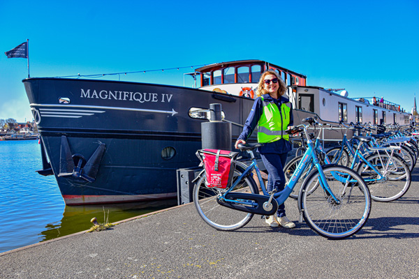 Tour leader Corrie poses in front of the ship