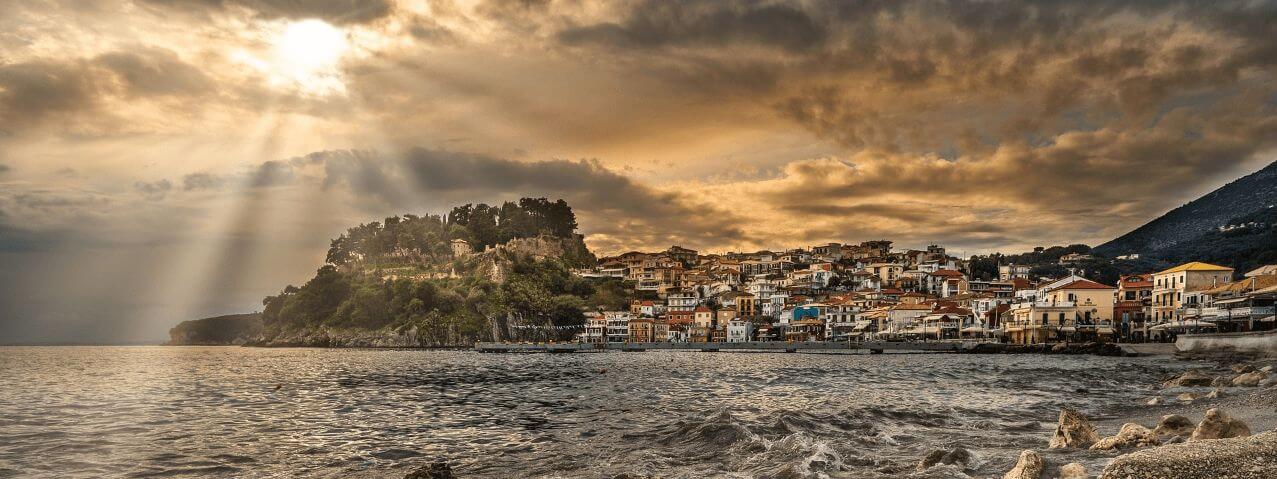 Greece sea city with sun