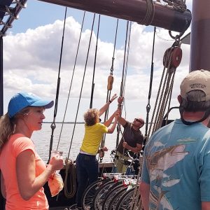 Guests hoisting the sails