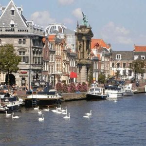 Town of Haarlem with a canal, boats and houses in the picture