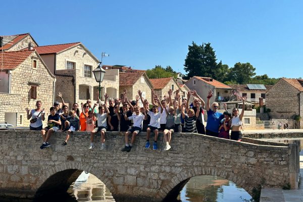 family tour group on bridge